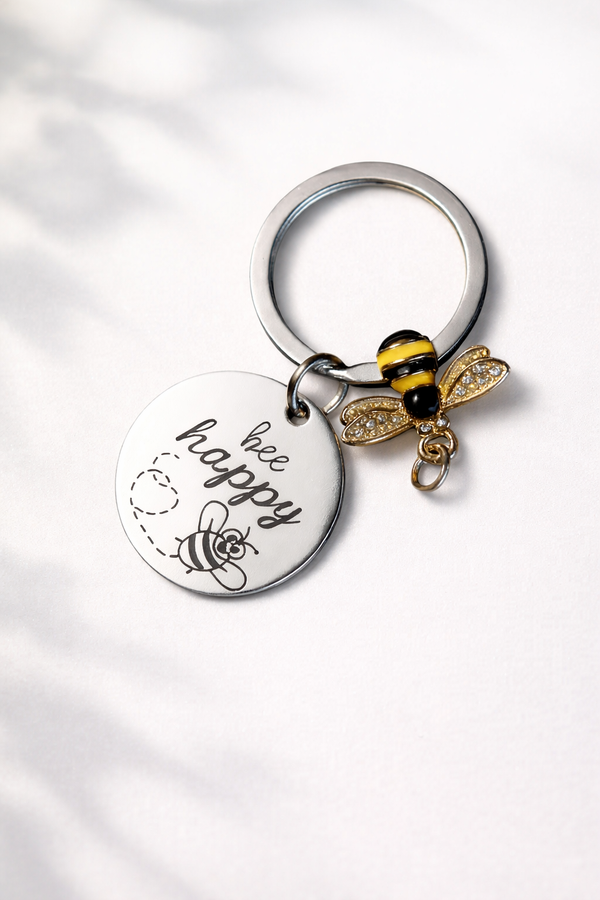 Silberner Schlüsselanhänger mit Gravur "Bee happy" mit Biene als Motiv